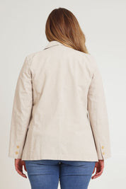 Model Chanel wearing size 16 of the Cotton Linen Longline Blazer in colour Sand, from the back