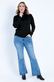 Model Jess wearing size 14 of the Merino Wool Skivvy in colour Black (Black), from the front, showing the whole outfit