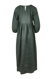 Product shot of the Linen Gathered Waist Dress in colour Green (Green), from the back