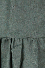 Product shot of the Linen Gathered Waist Dress in colour Green (Green), detail