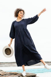 Model Lala wearing size 10 of the Linen Gathered Waist Dress in colour Navy (Blue), from the front, showing the whole outfit