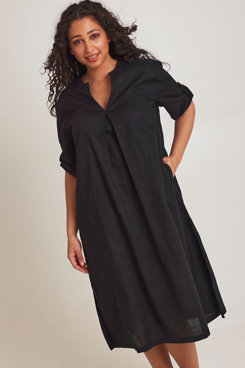 Model Terri-Leigh wearing size 14 of the Linen Cotton Summer Relaxed Dress in colour Black (Black), from the front, cropped image