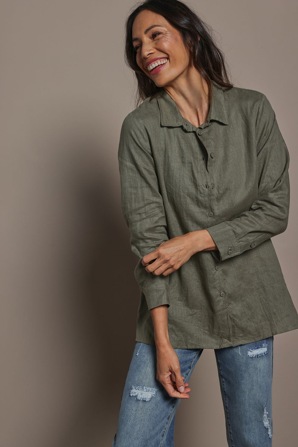 Model Amandam wearing size 10 of the Linen Oversized Boyfriend Shirt - Olive in colour Olive, from an angle