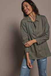 Model Amandam wearing size 10 of the Linen Oversized Boyfriend Shirt - Olive in colour Olive, from an angle