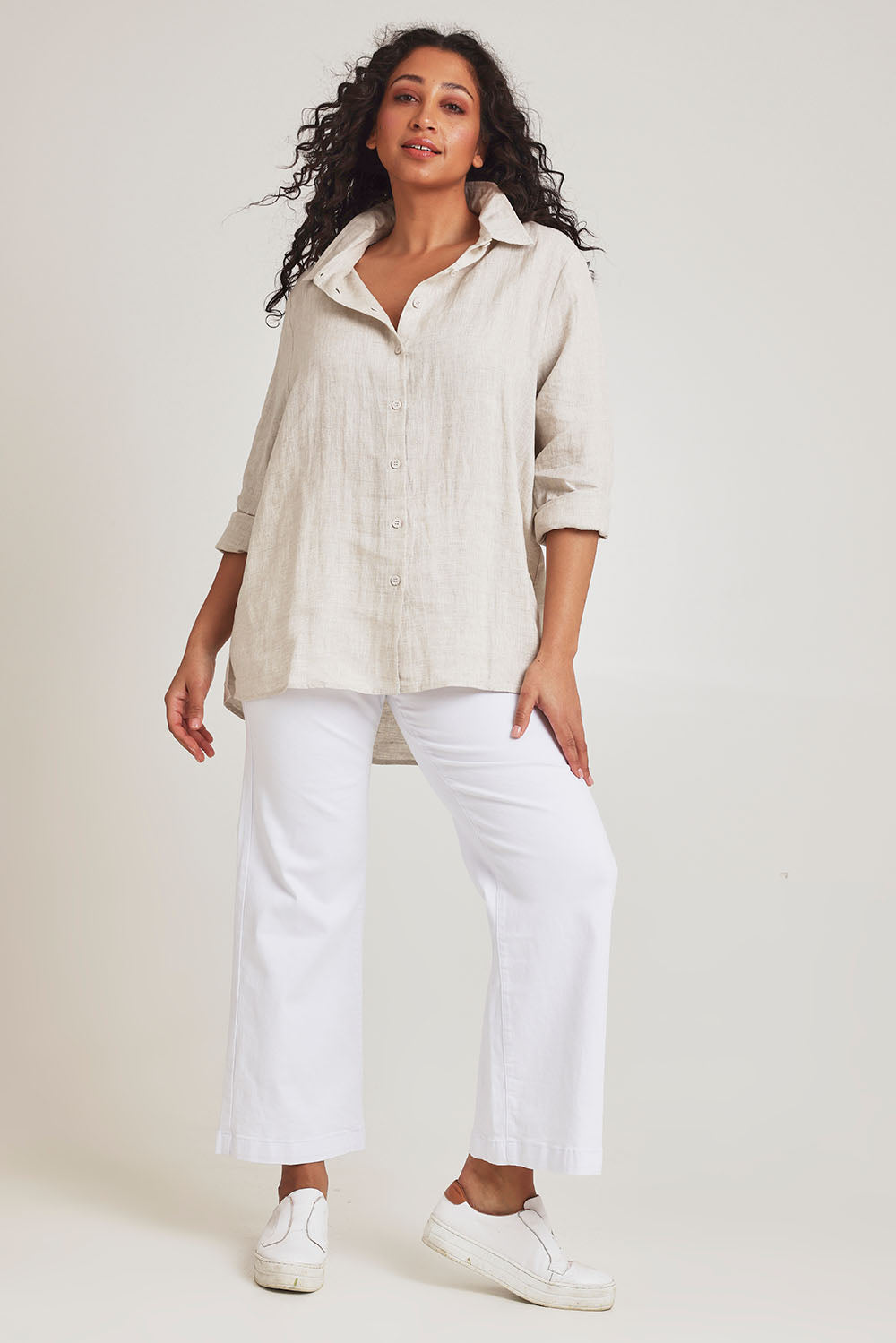 Model Terri-Leigh wearing size 14 of the Linen Oversized Boyfriend Shirt in colour Sand, from the front, showing the whole outfit