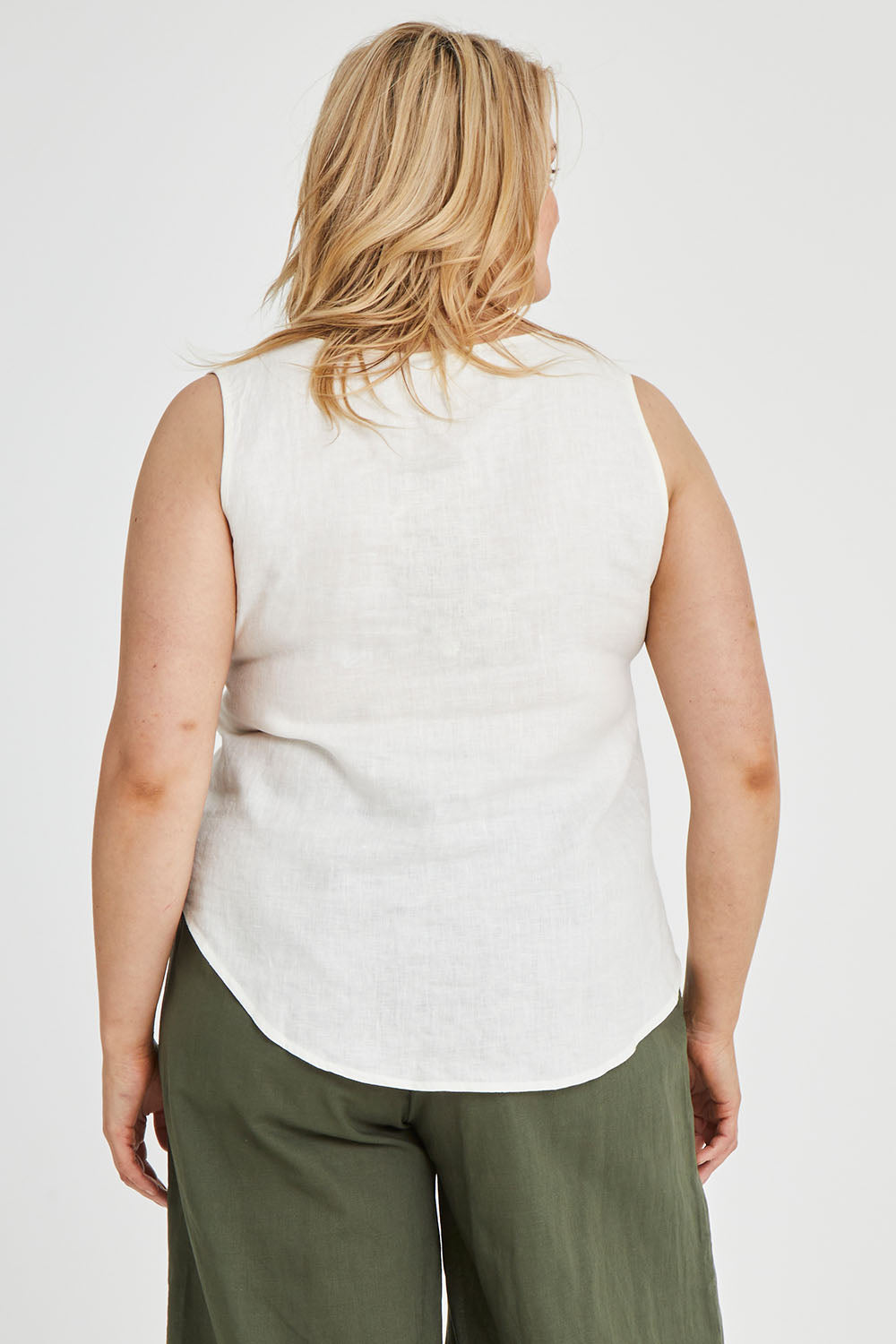 Model Keeara wearing size 16 of the Linen Tank in colour White (White), from the back