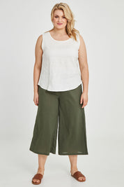 Model Keeara wearing size 16 of the Linen Tank in colour White (White), from the front, showing the whole outfit