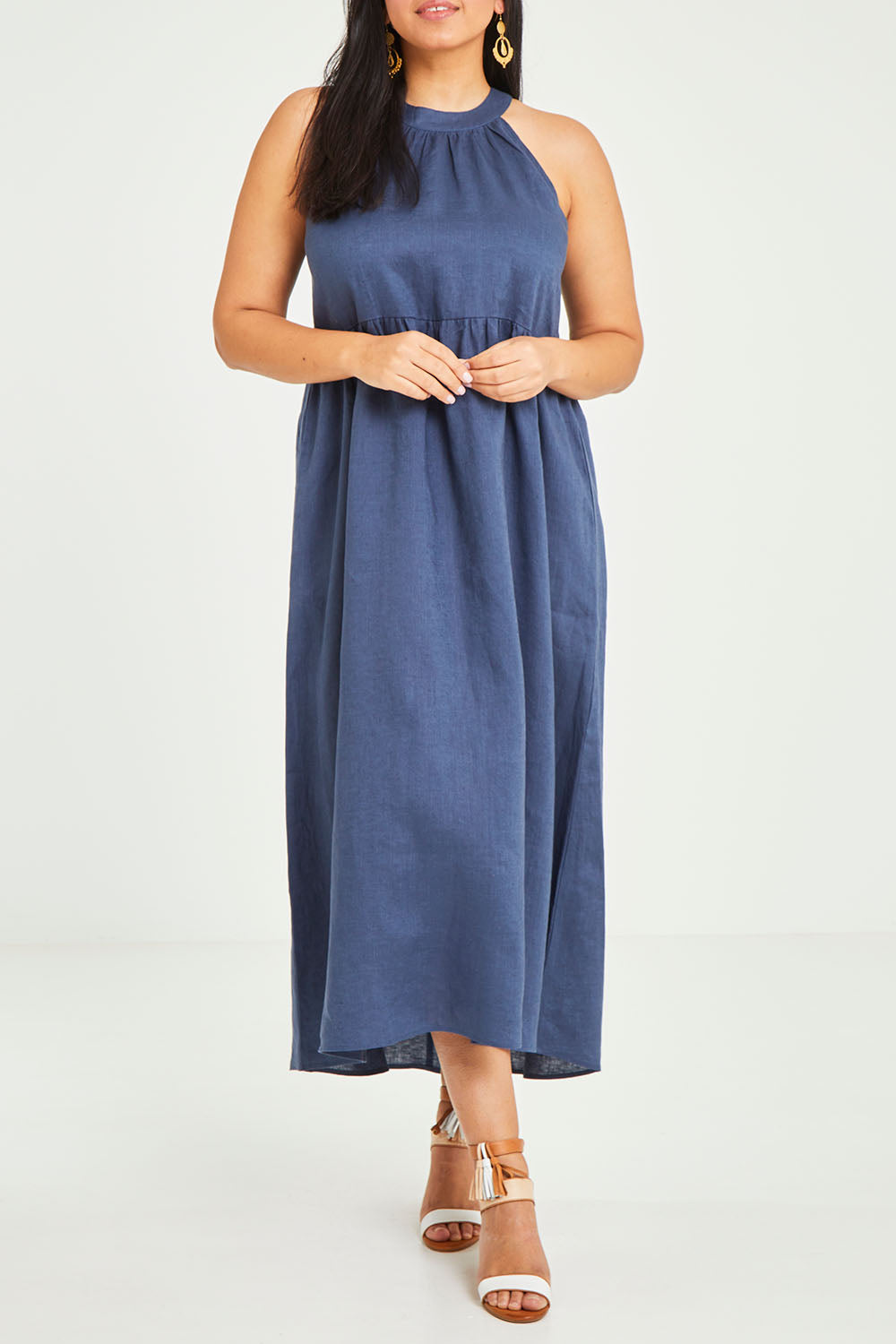 Model Terri-Leigh wearing size 14 of the Linen Halter Neck Dress in colour Blue (Blue), from the front, cropped image