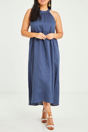 Model Terri-Leigh wearing size 14 of the Linen Halter Neck Dress in colour Blue (Blue), from the front, cropped image