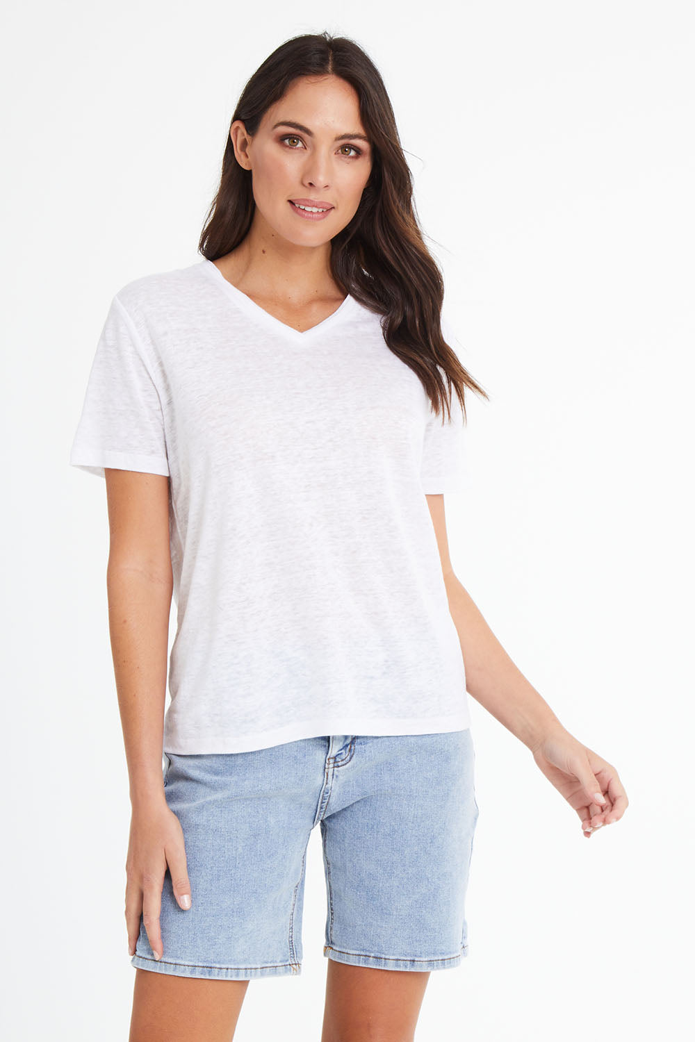 Model Madeline wearing size 10 of the Linen V Neck Top in colour White (White), from the front, cropped image