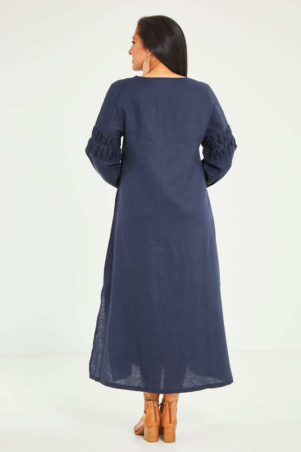 Model Terri-Leigh wearing size 14 of the Linen Honeycomb Sleeve Dress in colour Navy (Blue), from the back