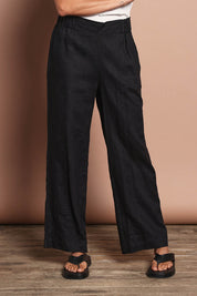 Model Amanda wearing size 10 of the Linen Wide Leg Pant in colour Black (Black), from the front, cropped image