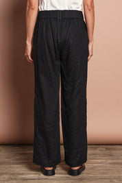 Model Amanda wearing size 12 of the Linen Wide Leg Pant in colour Black (Black), from the back