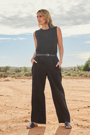Model Tegan wearing size 10 of the Linen Wide Leg Pant in colour Black (Black), from the front, showing the whole outfit