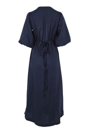Product shot of the Linen Cotton Puff Sleeve Wrap Dress in colour Navy (Blue), from the back