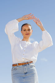 Model Lala wearing size 10 of the Relaxed Linen Blouse in colour White (White), from the front, showing the whole outfit