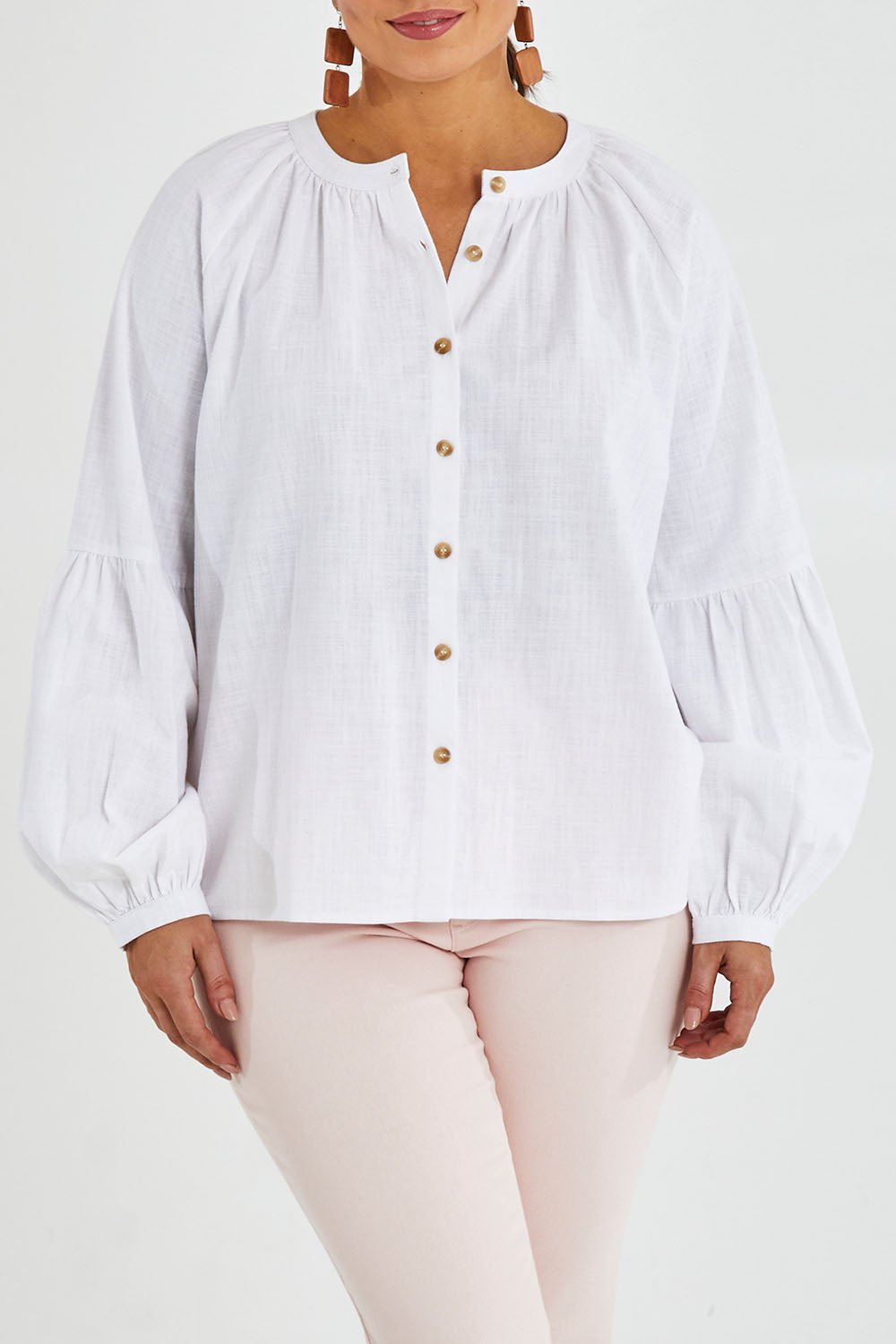 Model Monique wearing size 14 of the Relaxed Linen Blouse in colour White (White), from the front, cropped image
