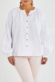 Model Monique wearing size 14 of the Relaxed Linen Blouse in colour White (White), from the front, cropped image