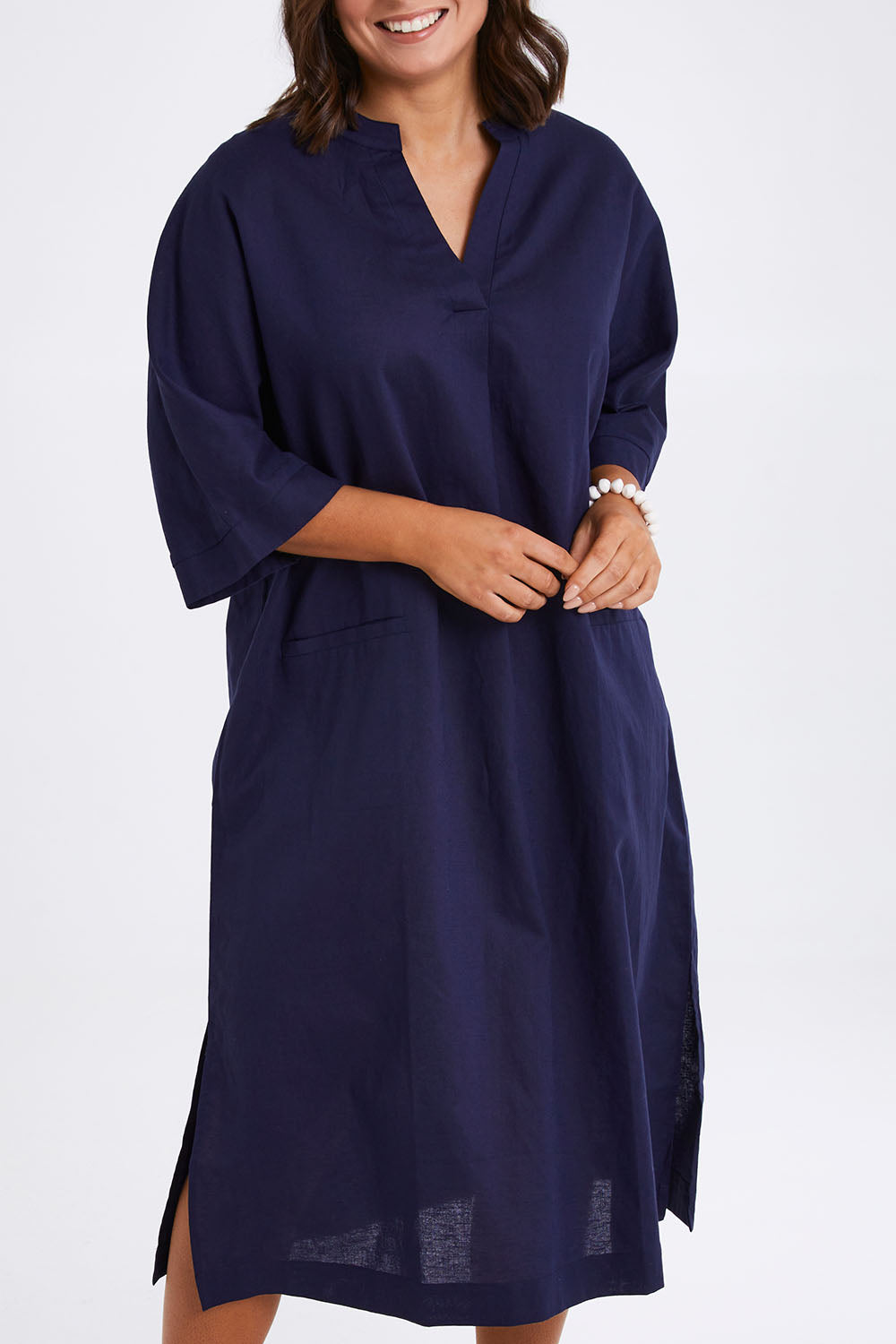 Model Monique wearing size 14 of the Linen Cotton Throw Dress in colour Navy (Blue), from the front, cropped image