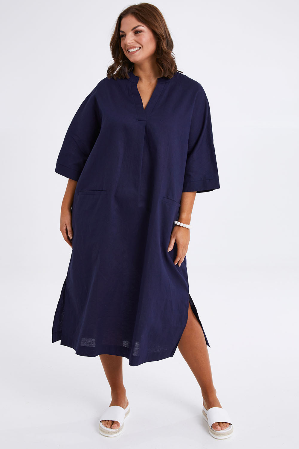 Model Monique wearing size 14 of the Linen Cotton Throw Dress in colour Navy (Blue), from the front, showing the whole outfit