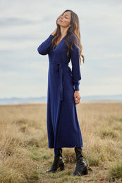 Model Amanda wearing size S of the Cotton Cashmere Wrap Dress in colour Navy (Blue), from the front, showing the whole outfit