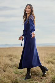 Model Amanda wearing size S of the Cotton Cashmere Wrap Dress in colour Navy (Blue), from the front, showing the whole outfit