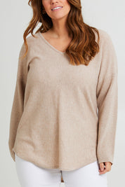 Model Laura wearing size L of the Wool Cashmere V Sweater in colour Natural, from the front, cropped image