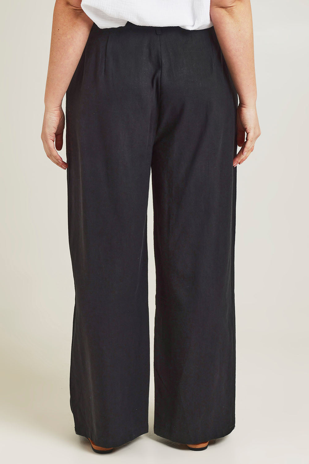 Model Jane wearing size 14 of the Ramie Tencel Straight Pant in colour Black (Black), from the back