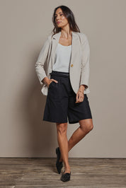 Model Summer wearing size 10 of the Linen Cotton Long Short in colour Black (Black), from the front, showing the whole outfit