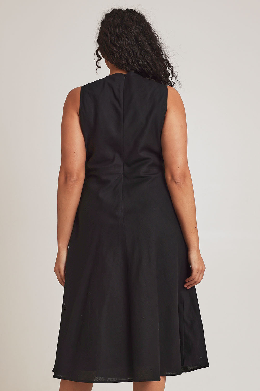 Model Terri-Leigh wearing size 14 of the Linen Cotton Midi Bias Dress in colour Black (Black), from the back
