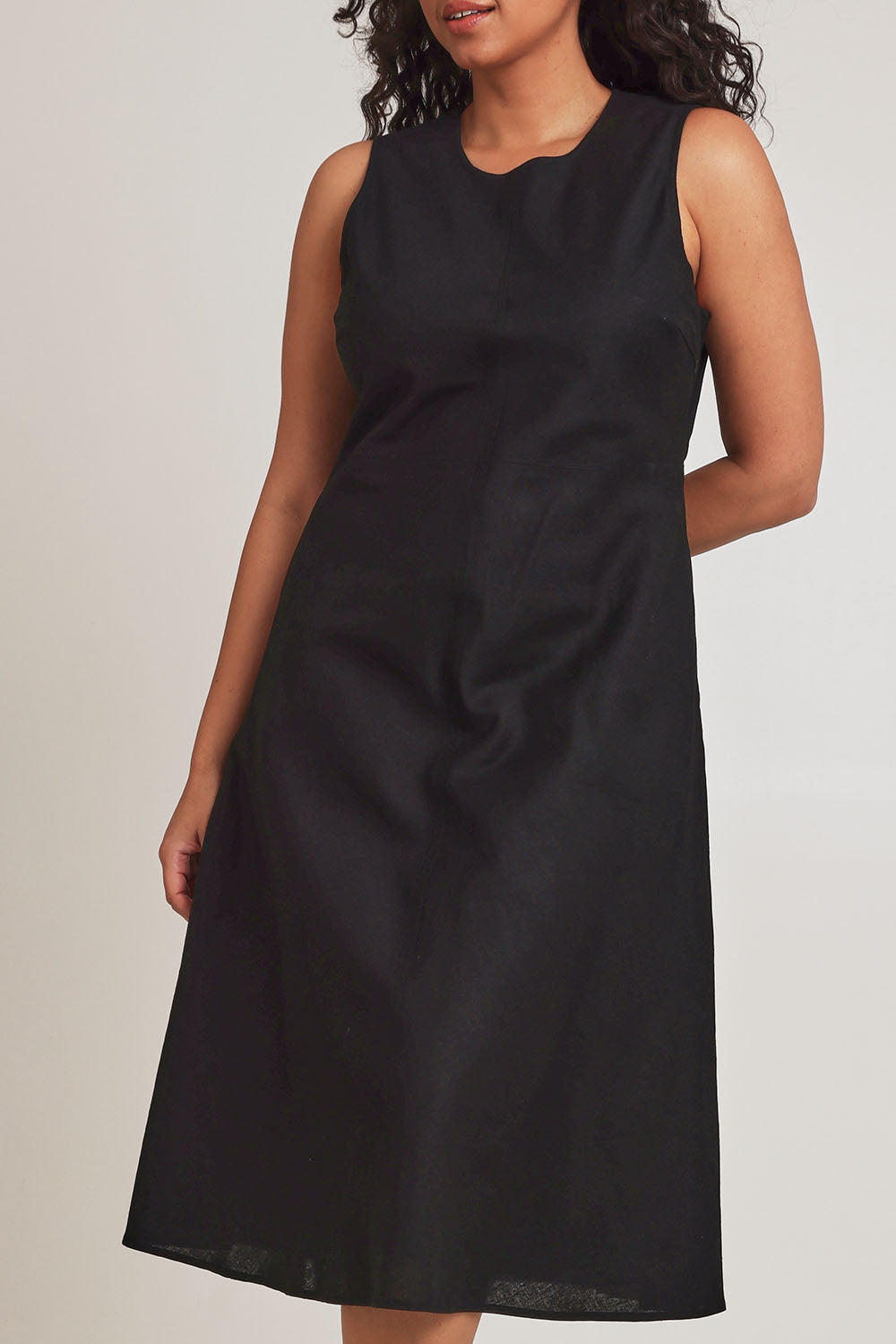 Model Terri-Leigh wearing size 14 of the Linen Cotton Midi Bias Dress in colour Black (Black), from the front, cropped image