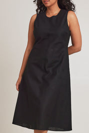 Model Terri-Leigh wearing size 14 of the Linen Cotton Midi Bias Dress in colour Black (Black), from the front, cropped image