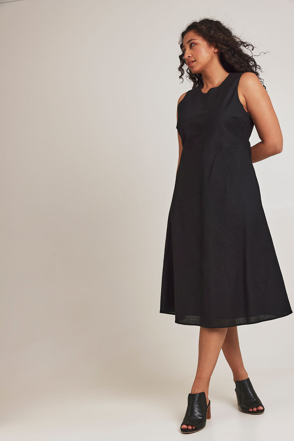 Model Terri-Leigh wearing size 14 of the Linen Cotton Midi Bias Dress in colour Black (Black), from the front, showing the whole outfit