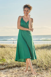 Model Lala wearing size 10 of the Linen Cotton Summer Midi Dress in colour Fern (Green), from the front, showing the whole outfit