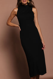 Model Madeline wearing size S of the Cotton Cashmere Sleeveless Layering Dress in colour Black (Black), from the front, cropped image