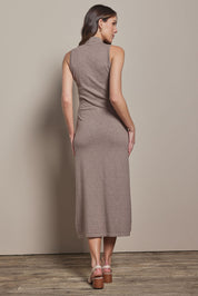 Model Madeline wearing size S of the Cotton Cashmere Sleeveless Layering Dress in colour Natural, from the back