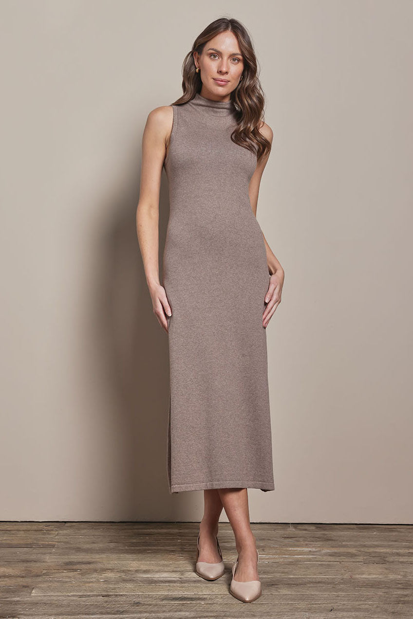 Model Madeline wearing size S of the Cotton Cashmere Sleeveless Layering Dress in colour Natural, from the front, showing the whole outfit