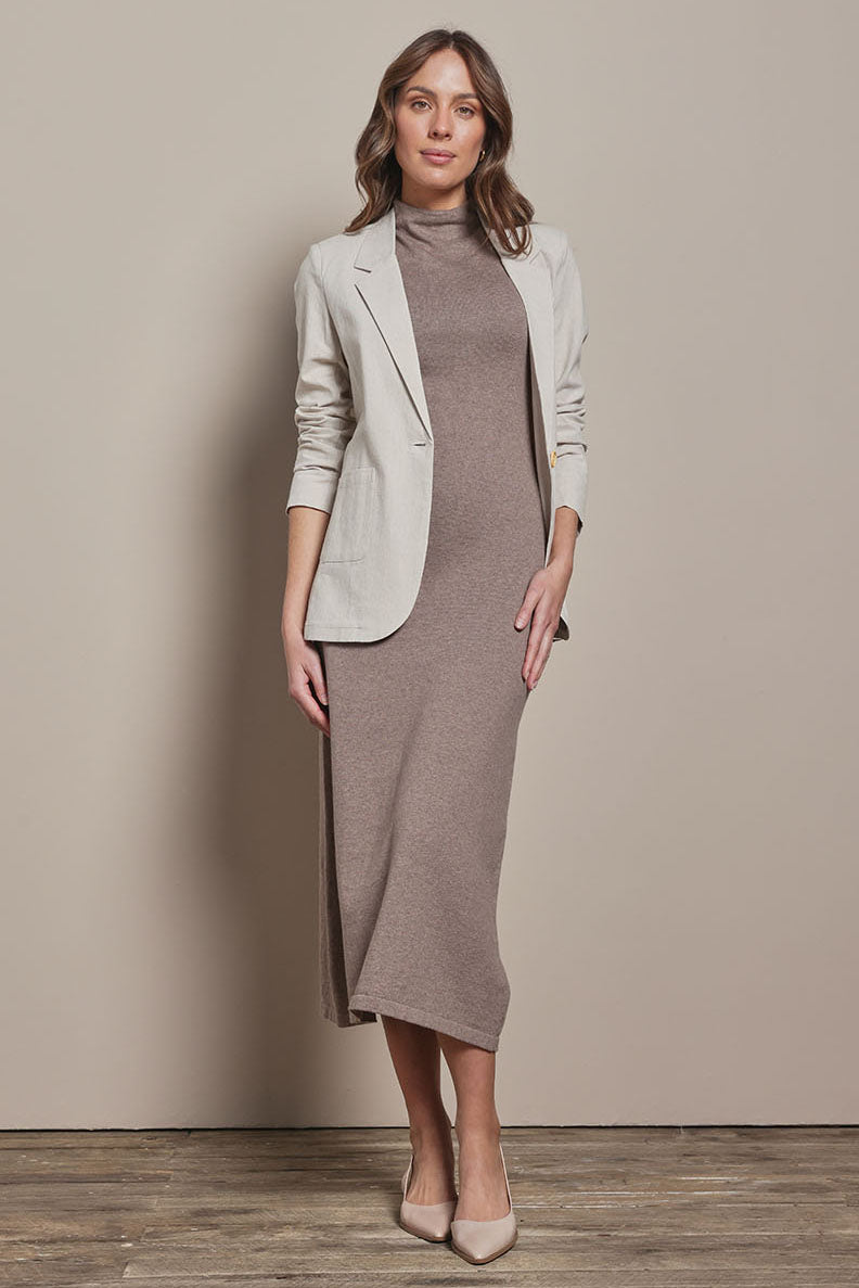 Model Madeline wearing size S of the Cotton Cashmere Sleeveless Layering Dress in colour Natural, from the front, showing the whole outfit