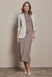 Model Madeline wearing size S of the Cotton Cashmere Sleeveless Layering Dress in colour Natural, from the front, showing the whole outfit