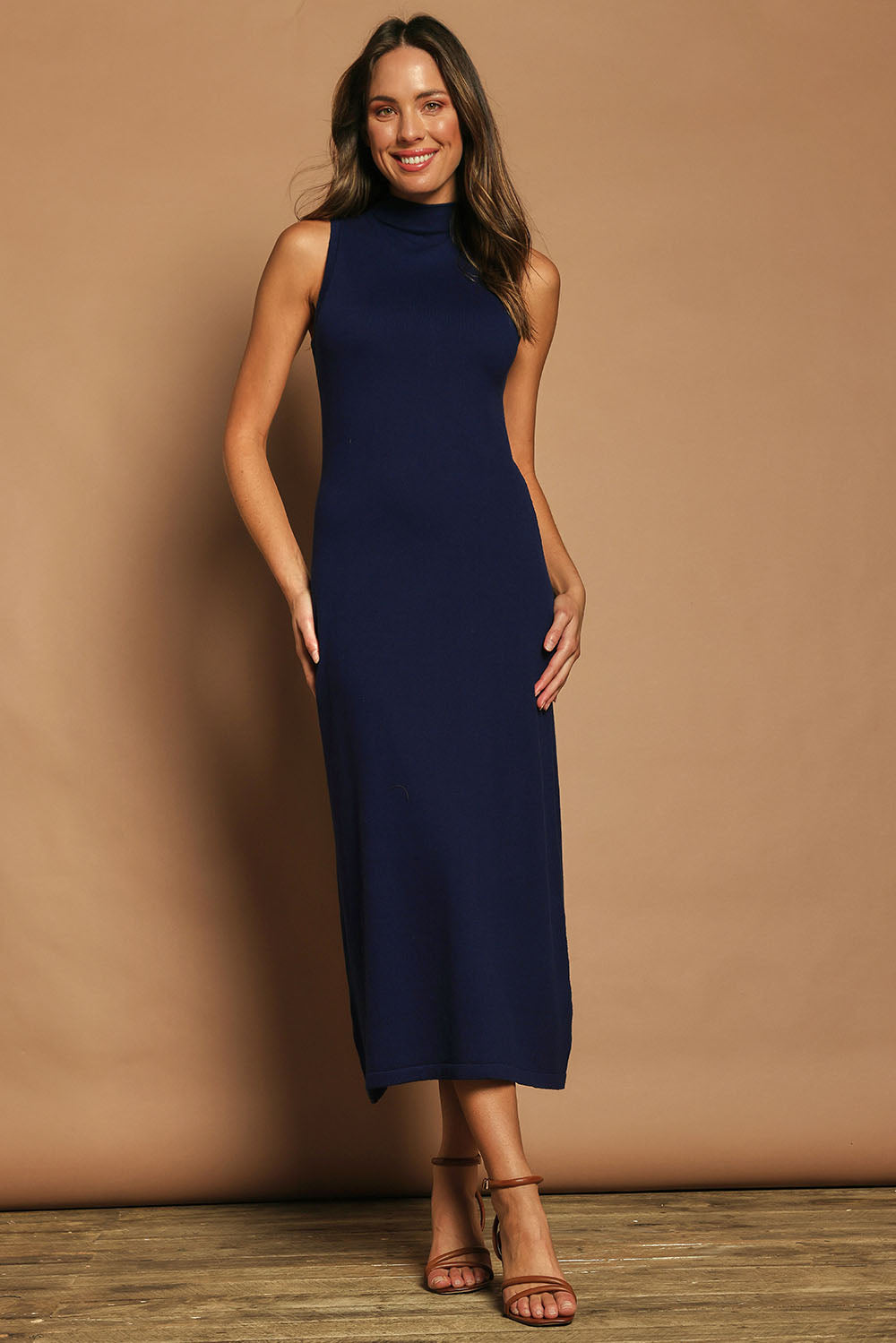Model Madeline wearing size S of the Cotton Cashmere Sleeveless Layering Dress in colour Navy (Blue), from the front, showing the whole outfit