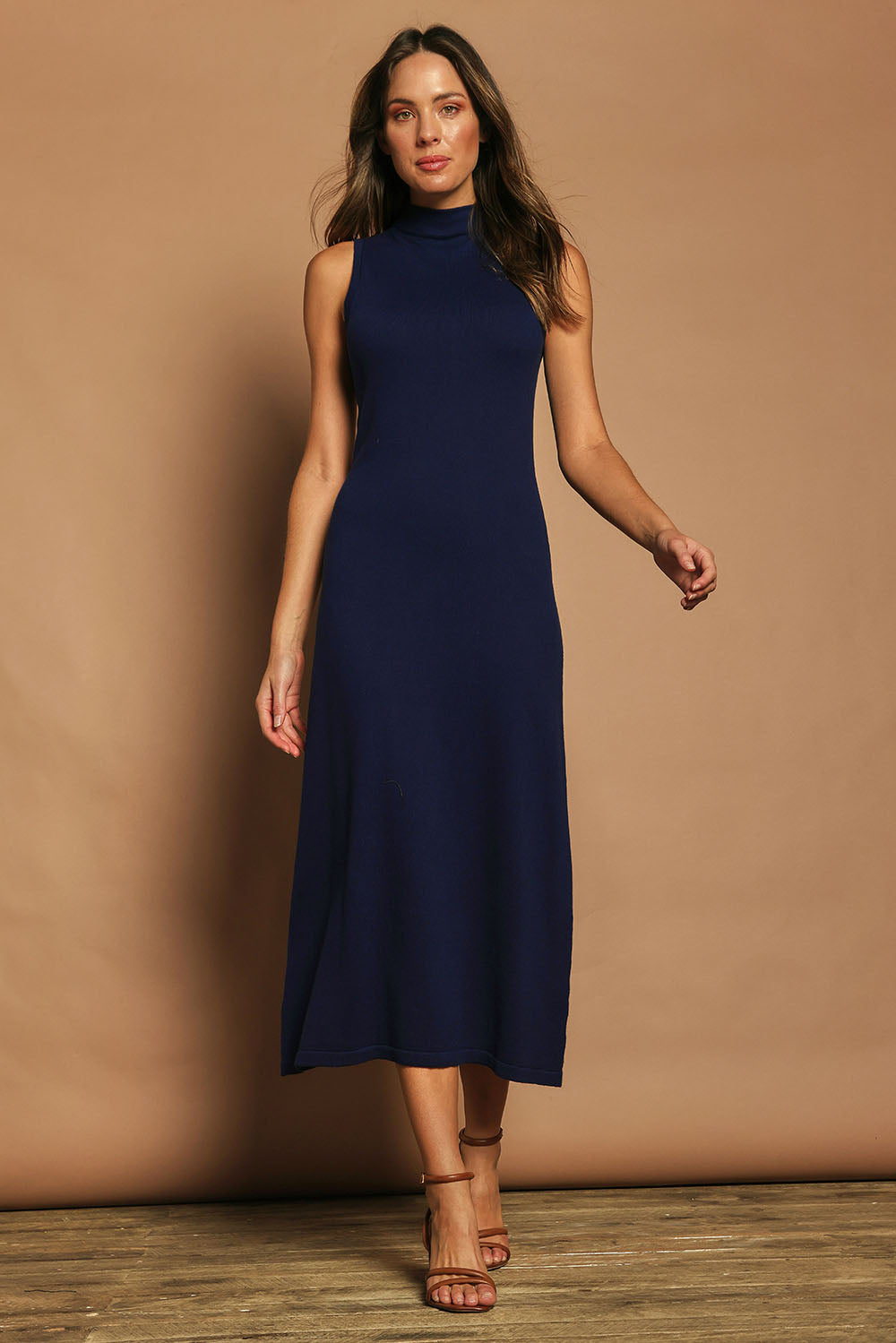 Model Madeline wearing size S of the Cotton Cashmere Sleeveless Layering Dress in colour Navy (Blue), from the front, showing the whole outfit