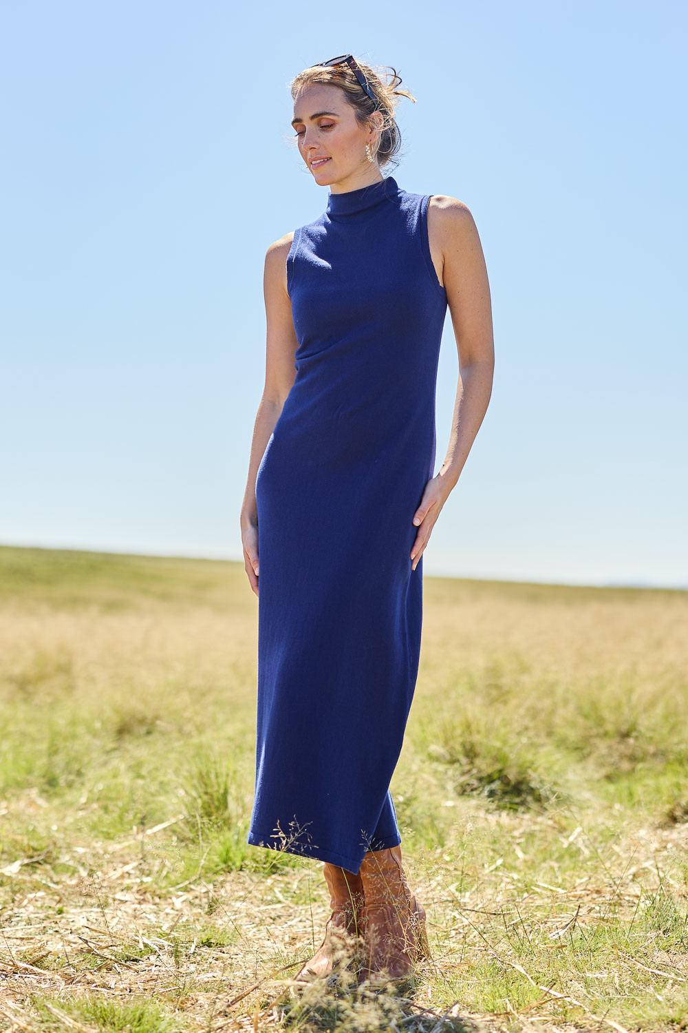 Model Tegan wearing size S of the Cotton Cashmere Sleeveless Layering Dress in colour Navy (Blue), from the front, showing the whole outfit