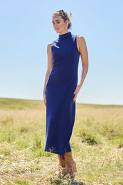 Model Tegan wearing size S of the Cotton Cashmere Sleeveless Layering Dress in colour Navy (Blue), from the front, showing the whole outfit