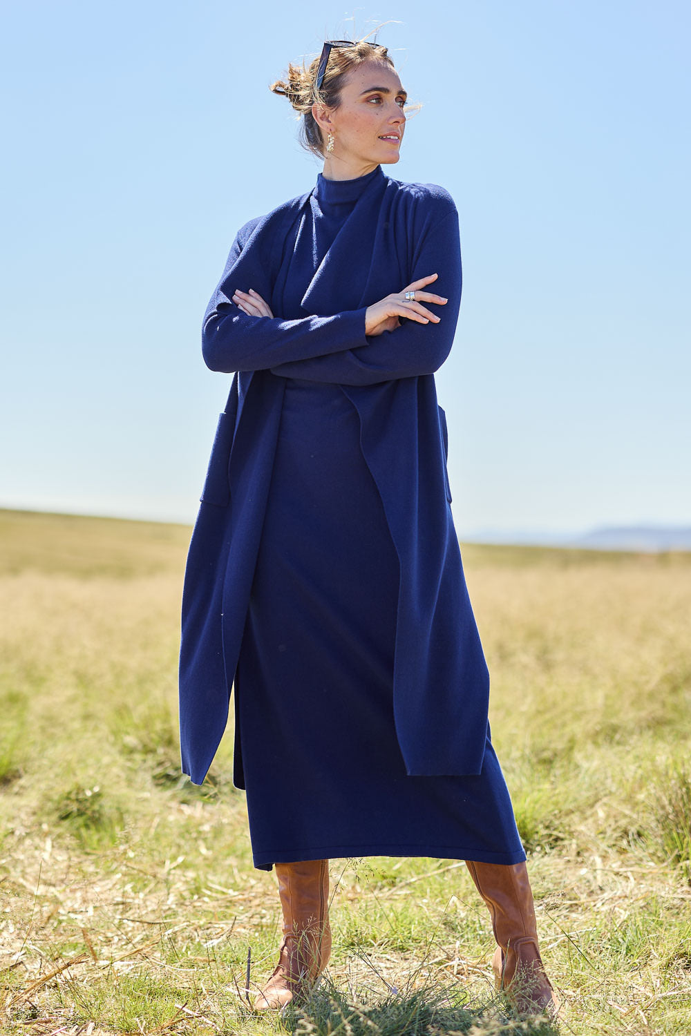 Model Tegan wearing size S of the Cotton Cashmere Sleeveless Layering Dress in colour Navy (Blue), from the front, showing the whole outfit