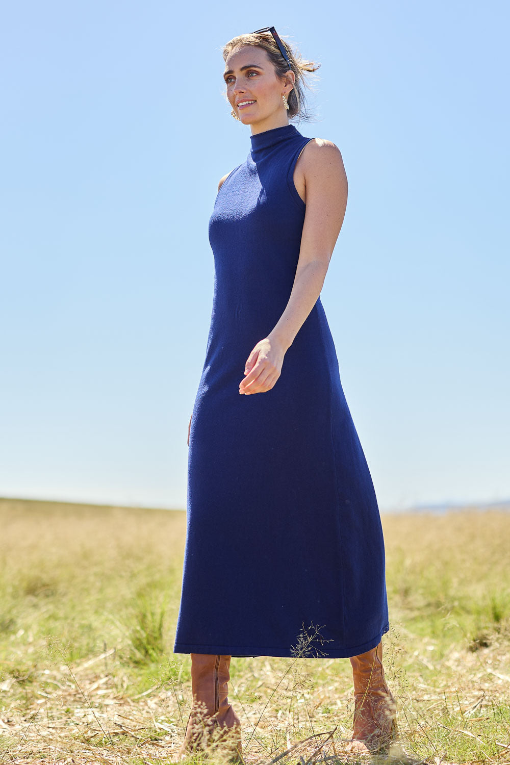 Model Tegan wearing size S of the Cotton Cashmere Sleeveless Layering Dress in colour Navy (Blue), from the front, showing the whole outfit