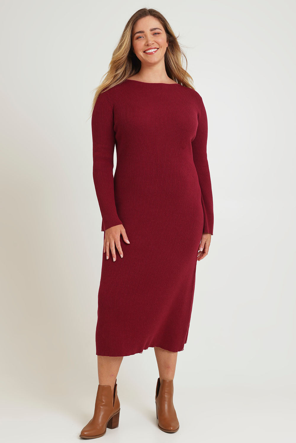 Model Chanel wearing size XL of the Cotton Cashmere Boat Neck Dress in colour Berry (Red), from the front, showing the whole outfit