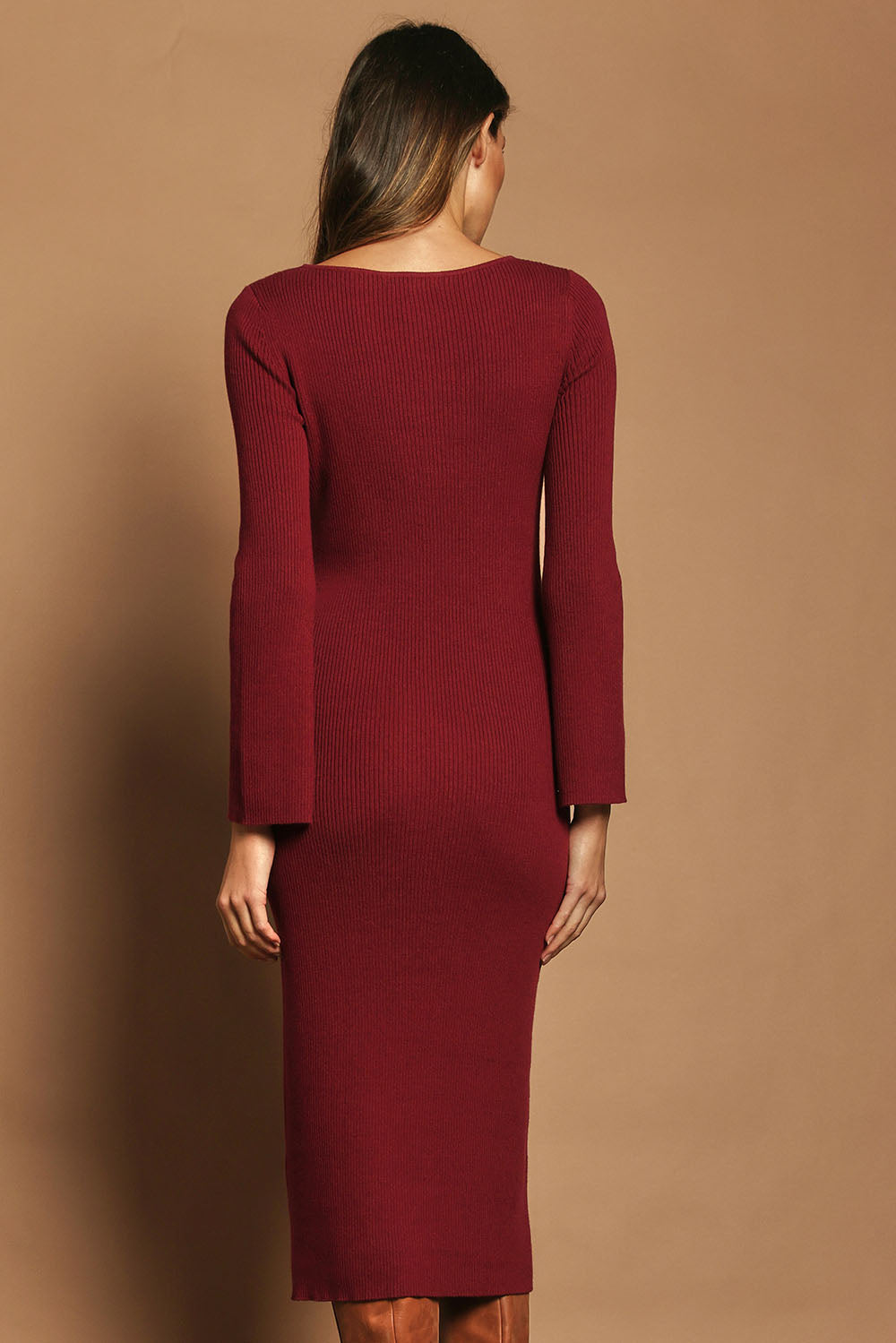 Model Madeline wearing size S of the Cotton Cashmere Boat Neck Dress in colour Berry (Red), from the back