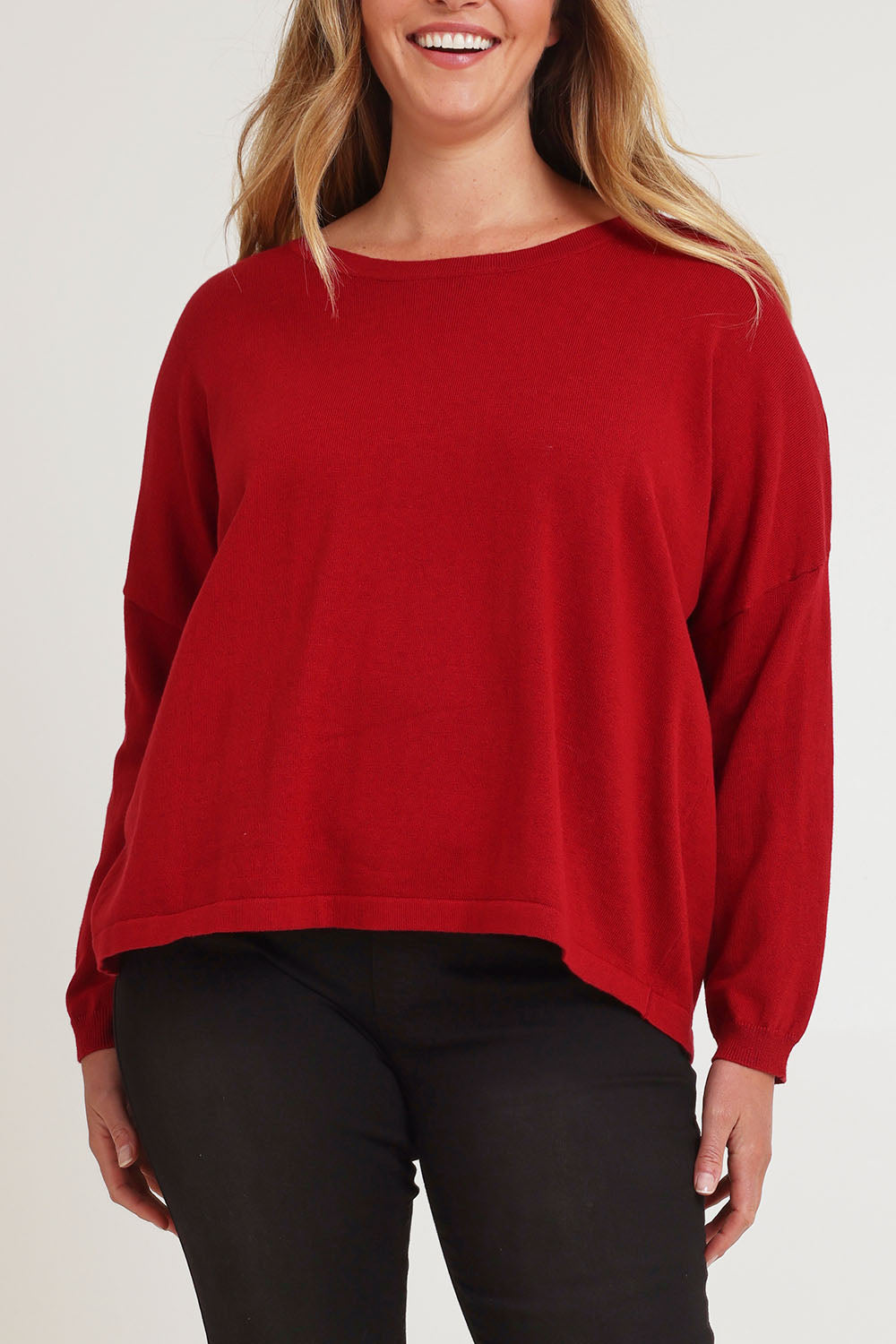 Model Chanel wearing size XL of the Cotton Cashmere Cross Back Sweater in colour Redrust (Red), from the front, cropped image