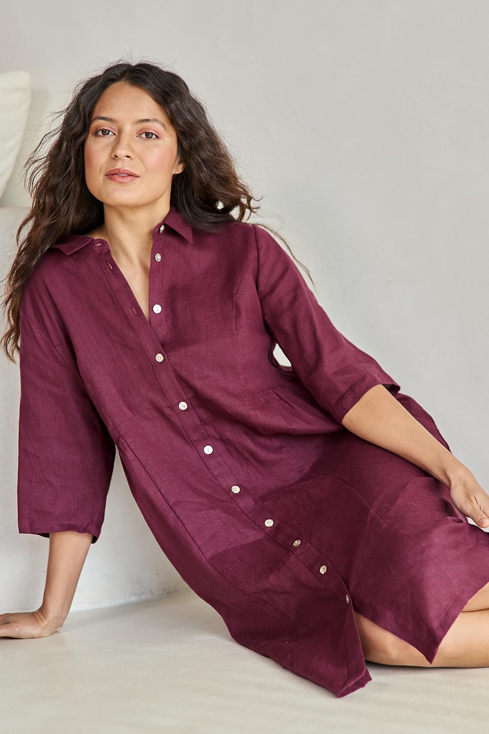 Model Tahneei wearing size 10 of the Linen Shirt Maker Dress – Plum in colour Plum, from an angle
