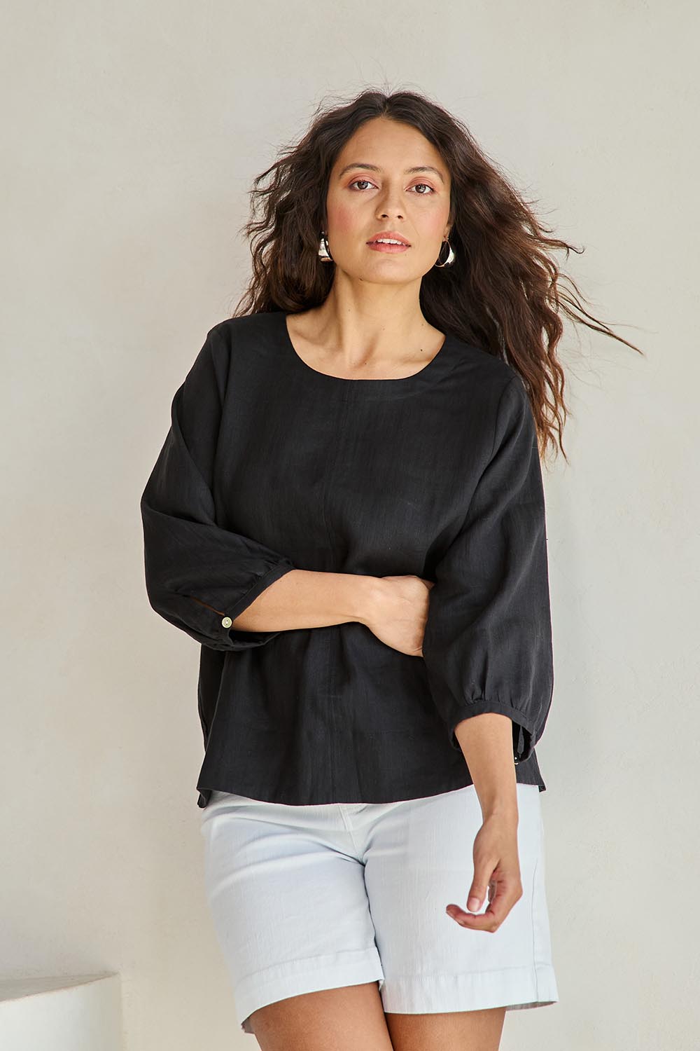 Model Tahneei wearing size 10 of the Linen 3/4 Sleeve Top – Black in colour Black, in a cropped view